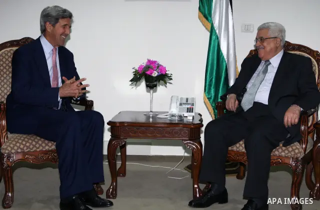 Palestinian President Mahmoud Abbas during a meeting with Senator John Kerry in the West Bank city of Ramallah on June 26, 2010. Photo by Thaer Ganaim