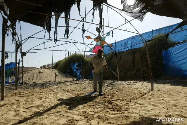 UN Relief and Works Agency (UNRWA) staff members inspect damages at a summer camp which was set on fire overnight by masked gunmen in Deir al-Balah center Gaza strip on June 28, 2010. Photo by Ashraf Amra