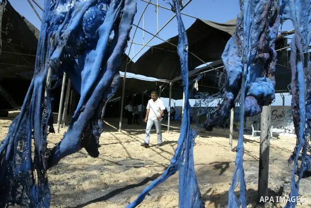 UN Relief and Works Agency (UNRWA) staff members inspect damages at a summer camp which was set on fire overnight by masked gunmen in Deir al-Balah center Gaza strip on June 28, 2010. Photo by Ashraf Amra