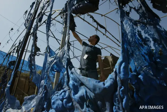 UN Relief and Works Agency (UNRWA) staff members inspect damages at a summer camp which was set on fire overnight by masked gunmen in Deir al-Balah center Gaza strip on June 28, 2010. Photo by Ashraf Amra