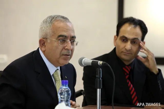 Palestinian Prime Minister Salam Fayyad during the launching of AL-Quds book for the photographer Osama AL-Slwadi in the West Bank city of Ramallah on June 28,2010. Photo by Mustafa Abu Dayeh / Pool