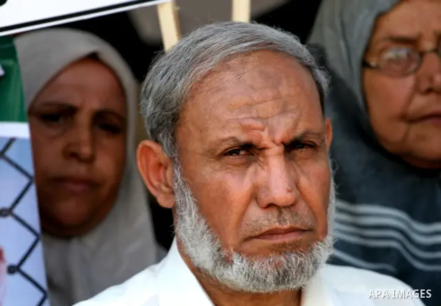 Palestinian Hamas leader Mahmoud Al Zahar speaks to journalists during a protest calling for the release of Palestinian prisoners, held in Israeli jails, in front of his house in Gaza City, Sunday, July 4, 2010. The fami...