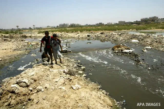 Raw sewage flows into the Mediterranean Sea on a beach south of Gaza City on July 5, 2010. Photo by Ashraf Amra