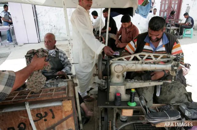 A Palestinian man fixing a used shoe in Rafah in the southern Gaza Strip on July 5, 2010. Israel is still deciding exactly what it will and will not allow into Gaza under a new approach towards the enclave, which it has...