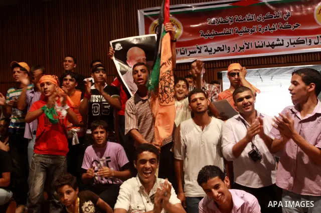 Palestinian supporters of Palestinian National Initiative movement take part in a celebration in the eighth anniversary of the movement founding on July 12,2010. Photo by Mohammed Asad