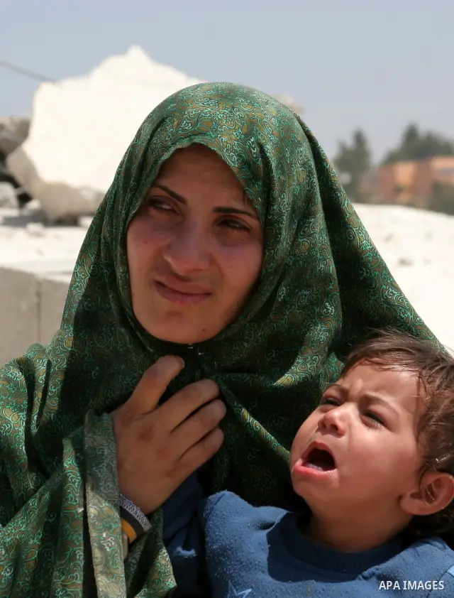 Palestinians inspect a demolished house in the village of Al-Samoua near the West Bank city of Hebron on July 15 2010. The Israeli government claimed that the houses that were demolished were not licensed, but the homeow...