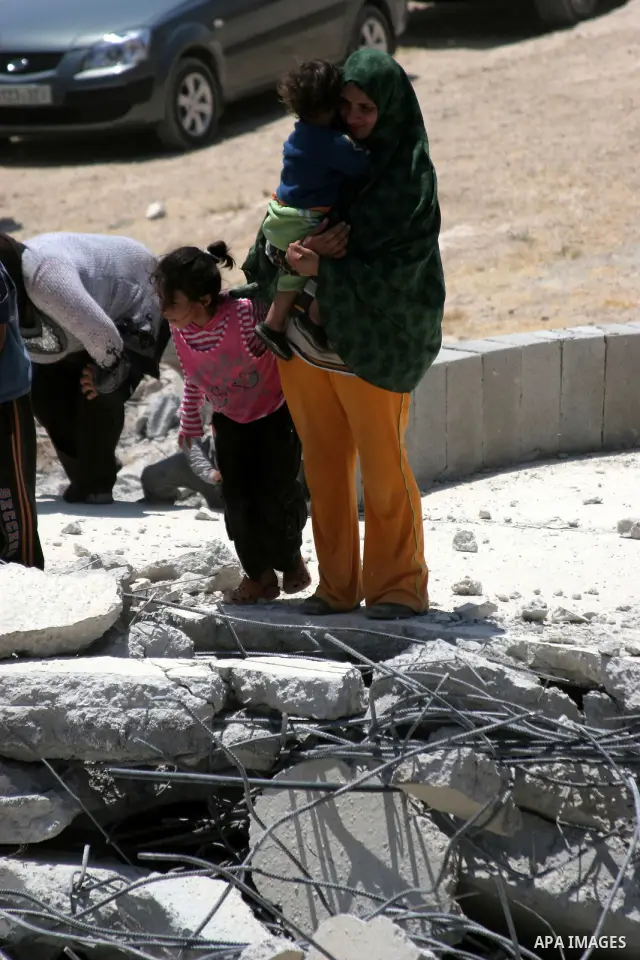 Palestinians inspect a demolished house in the village of Al-Samoua near the West Bank city of Hebron on July 15 2010. The Israeli government claimed that the houses that were demolished were not licensed, but the homeow...