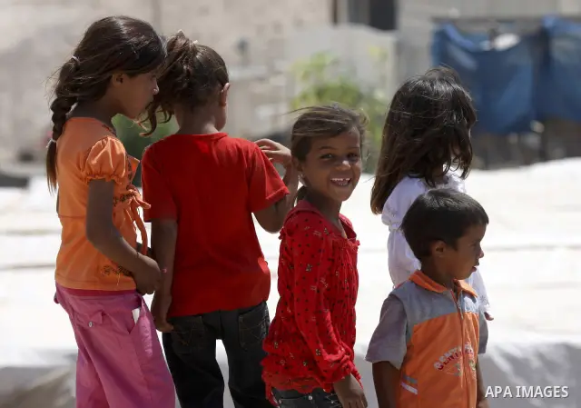 Palestinian Bedouin children play near their tents on the road between Jericho and Ramallah on July 15, 2010 as Palestinian bedouins live hard life in the West Bank. Photo by Eyad Jadallah