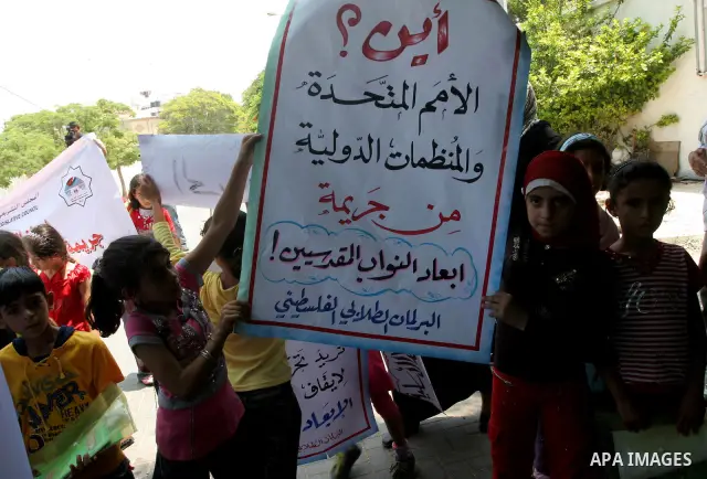 Palestinian children take part in a protest to support Hamas lawmakers in Jerusalem at the legislative council headquarters in Gaza city on July 15, 2010. Photo by Mohammed Asad