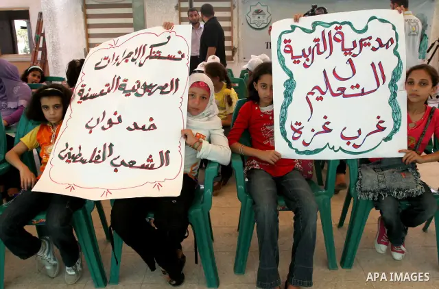 Palestinian children take part in a protest to support Hamas lawmakers in Jerusalem at the legislative council headquarters in Gaza city on July 15, 2010. Photo by Mohammed Asad