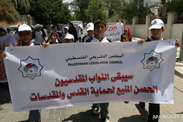 Palestinian children take part in a protest to support Hamas lawmakers in Jerusalem at the legislative council headquarters in Gaza city on July 15, 2010. Photo by Mohammed Asad