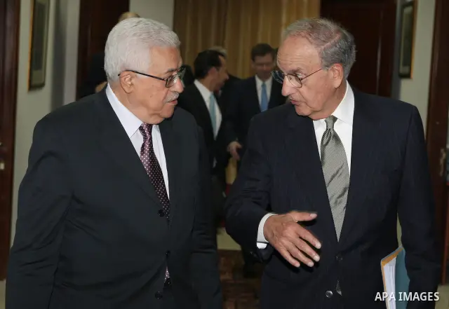 Palestinian President Mahmoud Abbas meets with the President Barack Obama's special envoy to the Middle East, George Mitchell in the West Bank city of Ramallah on July 17, 2010. Photo by Thaer Ganaim