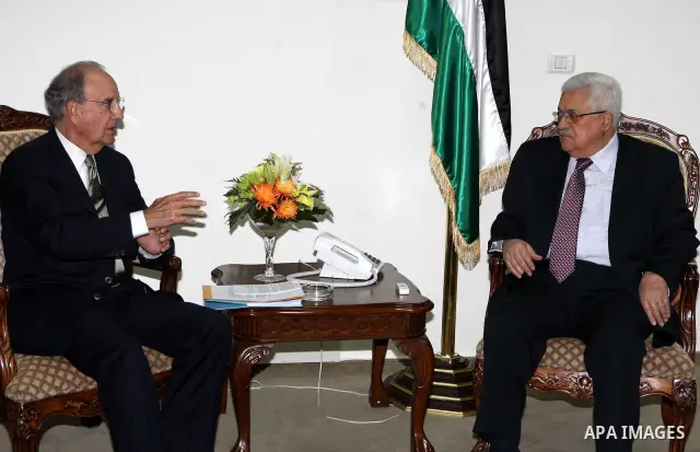 Palestinian President Mahmoud Abbas meets with the President Barack Obama's special envoy to the Middle East, George Mitchell in the West Bank city of Ramallah on July 17, 2010. Photo by Thaer Ganaim