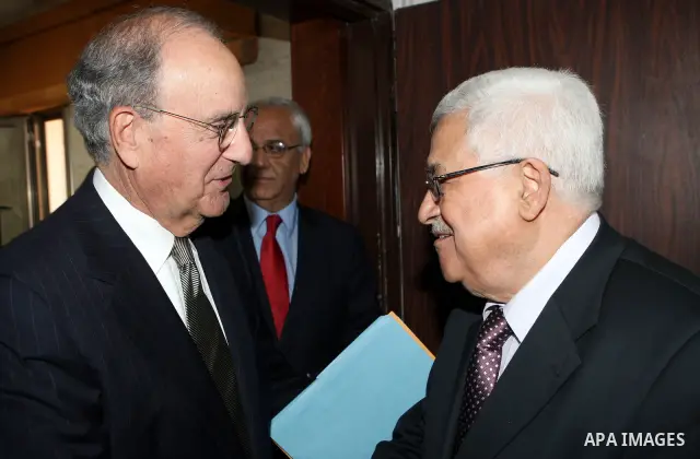 Palestinian President Mahmoud Abbas meets with the President Barack Obama's special envoy to the Middle East, George Mitchell in the West Bank city of Ramallah on July 17, 2010. Photo by Thaer Ganaim