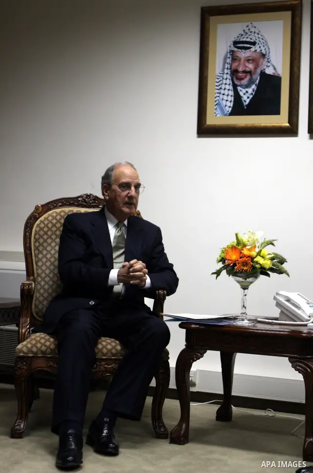 Palestinian President Mahmoud Abbas meets with the President Barack Obama's special envoy to the Middle East, George Mitchell in the West Bank city of Ramallah on July 17, 2010. Photo by Eyad Jadallah