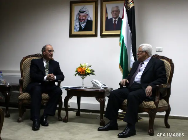 Palestinian President Mahmoud Abbas meets with the President Barack Obama's special envoy to the Middle East, George Mitchell in the West Bank city of Ramallah on July 17, 2010. Photo by Eyad Jadallah