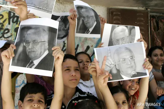 Palestinian children hold posters of President Mahmoud Abbas during a rally to support the peace process in Balata refugee camp near the west bank city of Nablus on July 17, 2010. Photo by Wagdi Eshtayah