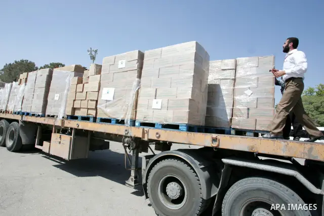 A convoy carrying medical aid which was shipped in on a Libyan aid ship to an Egyptian port crosses to the Palestinian Gaza Strip through the Rafah border between Egypt and southern Gaza Strip, on July 18, 2010. The Liby...