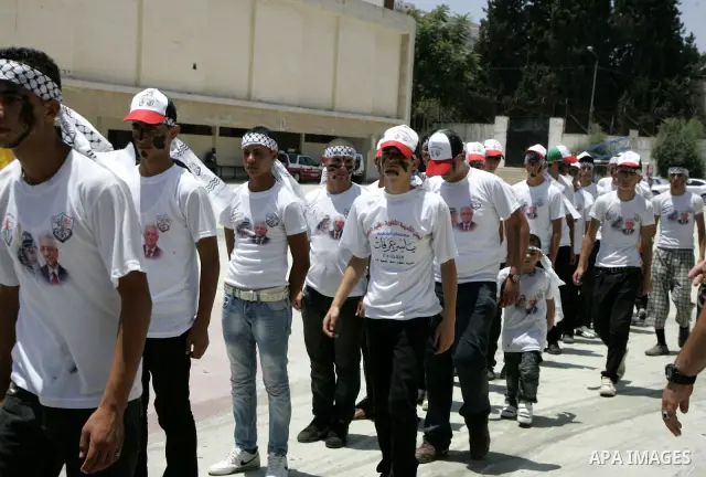 Palestinian children from the Fatah party participate in a training session during a summer camp in the West Bank city of Nablus, Sunday, July 18, 2010. Photo by Wagdi Eshtayah