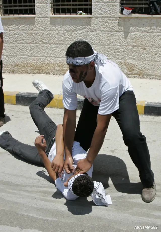 Palestinian children from the Fatah party participate in a training session during a summer camp in the West Bank city of Nablus, Sunday, July 18, 2010. Photo by Wagdi Eshtayah