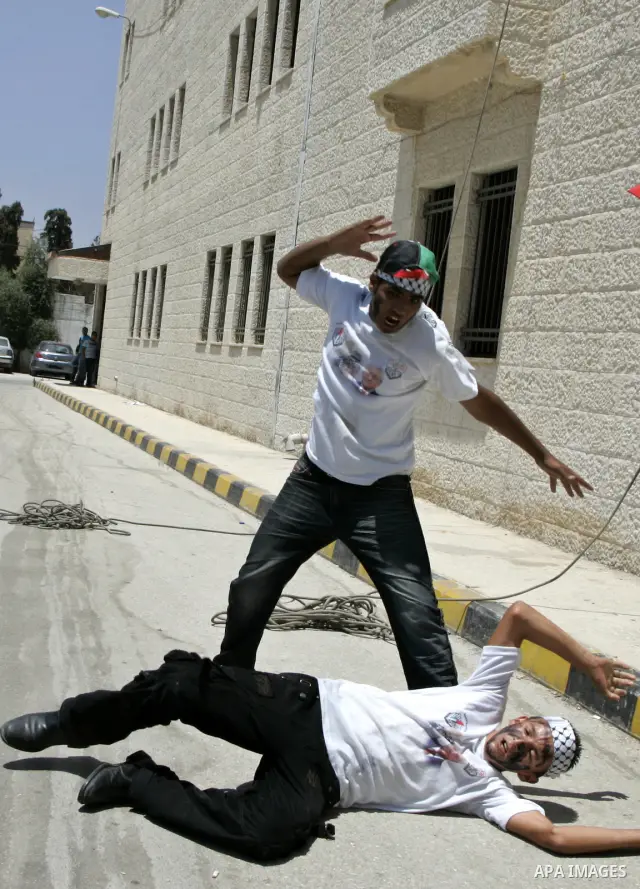 Palestinian children from the Fatah party participate in a training session during a summer camp in the West Bank city of Nablus, Sunday, July 18, 2010. Photo by Wagdi Eshtayah