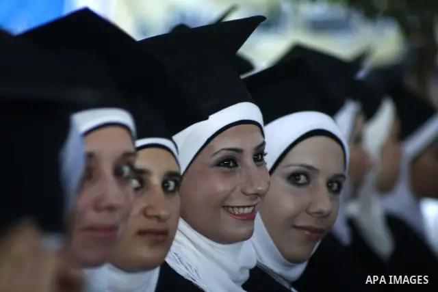 Palestinian students celebrate in their 29th graduation ceremony at Palestine Polytechnic University in the West Bank city of Hebron on July 18,2010. Photo by Mamoun Wazwaz