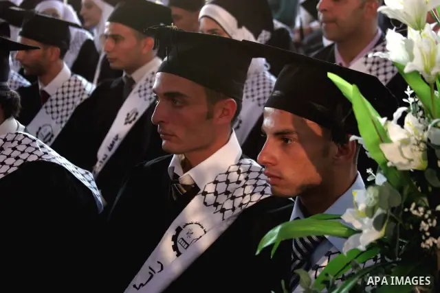 Palestinian students celebrate in their 29th graduation ceremony at Palestine Polytechnic University in the West Bank city of Hebron on July 18,2010. Photo by Mamoun Wazwaz