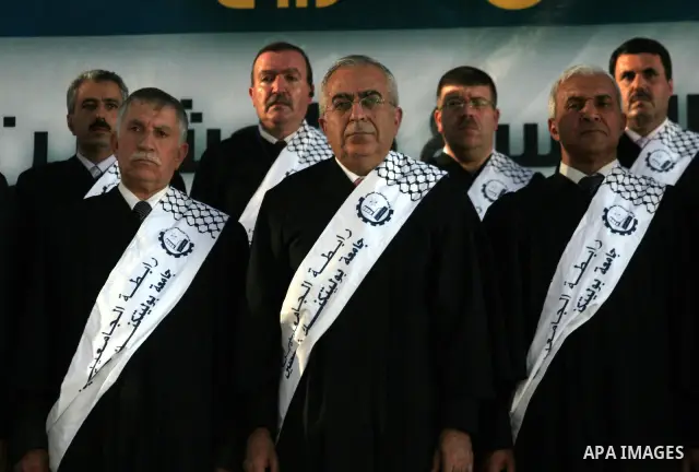 Palestinian Prime Minister Salam Fayyad participates in the 29th graduation ceremony at Palestine Polytechnic University in the West Bank city of Hebron on July 18,2010.. Photo by Mamoun Wazwaz