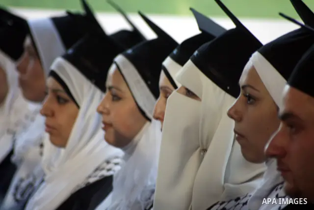 Palestinian students celebrate in their 29th graduation ceremony at Palestine Polytechnic University in the West Bank city of Hebron on July 18,2010. Photo by Mamoun Wazwaz