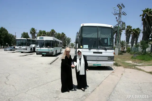 Palestinians wait to leave the crossing between Egypt and Gaza at Rafah, southern Gaza Strip on July 19, 2010. Number from Palestinians are heading to the holy places in Saudi Arabia for Umrah annual. Photo by Khaled Kha...