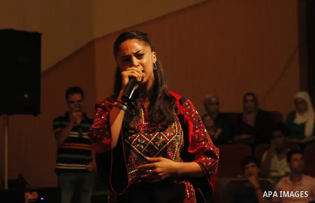 The British-Palestinian hip hop star Shadia Mansour performs during a party in the West Bank city of Hebron on July 20 2010. Mansour has a Palestinian origins and most of her songs are pro-Palestinians. Photo by Mamoun W...