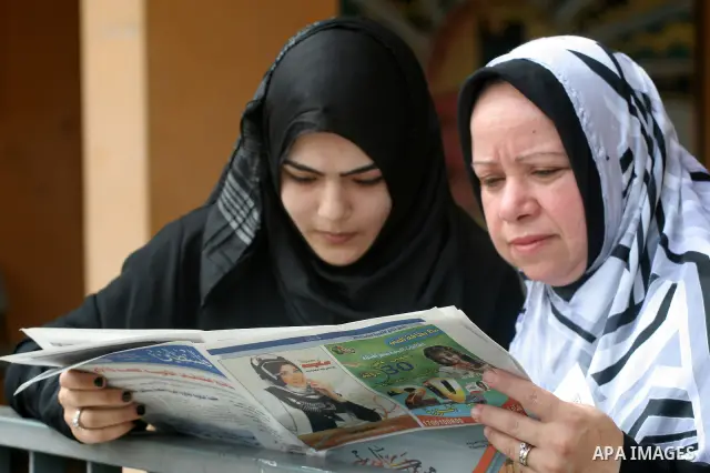 A Palestinian secondary school student reads a local newspaper to find his result in Gaza city on July 22,2010. The Ministry of Education in Gaza Strip and the West Bank announced the results together. Photo by Mohammed...
