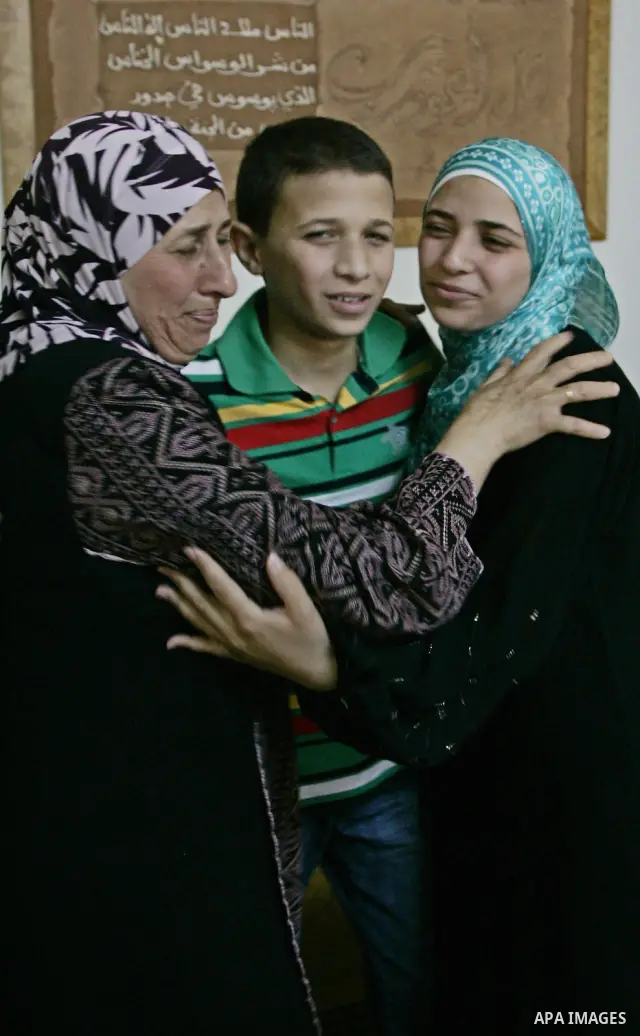 A Palestinian student from the top ten in the general secondary certificate in Palestine, Eiman Aljian, 99.5, is greeted by her family in the West Bank city of Nablus on July 22,2010. Photo by Wagdi Eshtayah