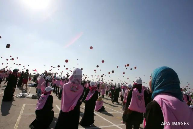 Thousands of Palestinian children dribble basketballs in an attempt to break the Guinness world record of 7,500 basketballs bounced simultaneously, in an event organized by the the United Nations Relief and Works Agency...