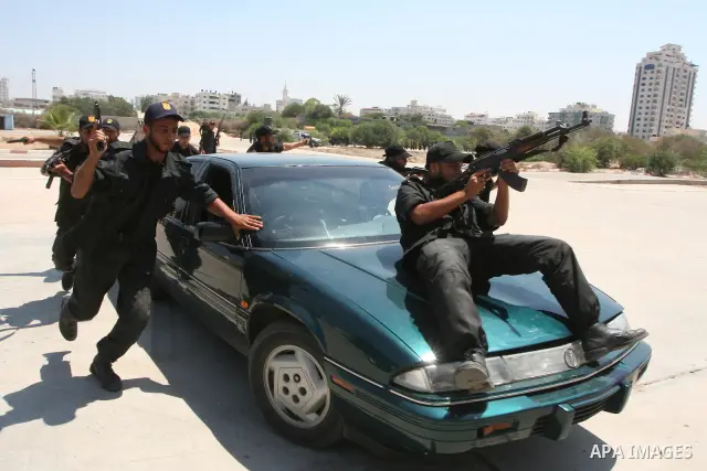 Palestinian security forces perform during an exercise at their graduation ceremony in Gaza City, Monday, July 26, 2010. Photo by Ashraf Amra