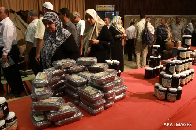 Palestinians participate in an exhibition for the palm trees products in Gaza city on July 28,2010.. Photo by Mohammed Asad