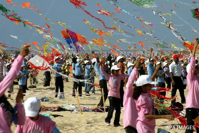 Palestinian children fly kites along the beach during a U.N. run summer camp in Gaza City on July 29, 2010. Thousands of children in the Gaza Strip gathered to break the world record for kite flying for the second time....