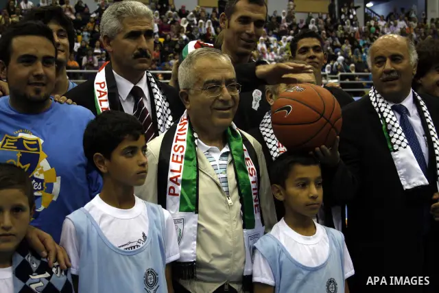 Palestinian Prime Minister Salam Fayyad attends the opening celebration of the closed Hebron sport hall in the West Bank city of Hebron on July 30,2010. Photo by Mamoun Wazwaz