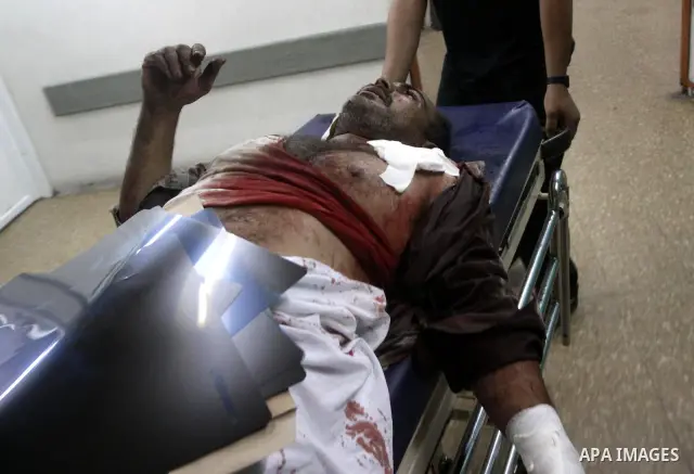 A wounded Palestinian man receives treatment at al-Shifa hospital in Gaza City, July 31, 2010. Israeli war jets struck on Friday night three targets in western Gaza city and in central and southern Gaza Strip, wounding a...