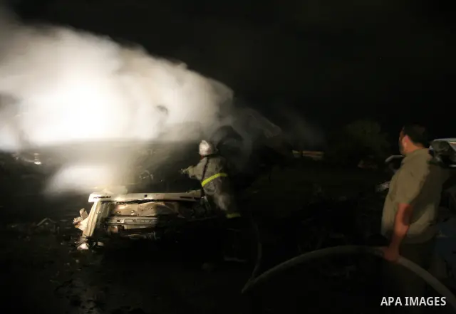 Palestinian fire fighter works on the scene following Israeli air-strike at a military site for Hamas in Gaza City, July 31, 2010. Israeli war jets struck on Friday night three targets in Gaza Strip, wounding at least ni...