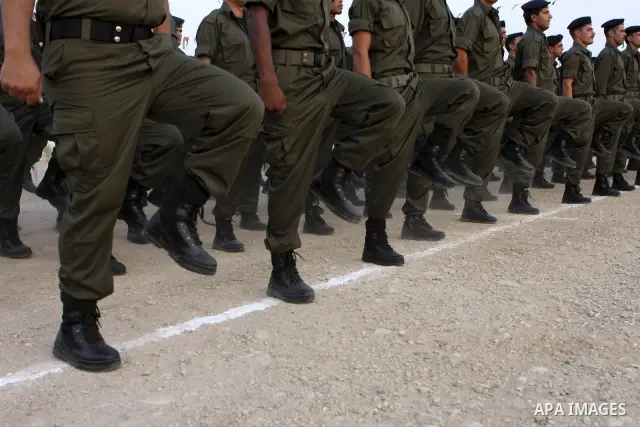 Members of the Palestinian security forces demonstrate their skills during a graduation ceremony in the West Bank city of Jericho, July 31, 2010. Photo by Eyad Jadallah