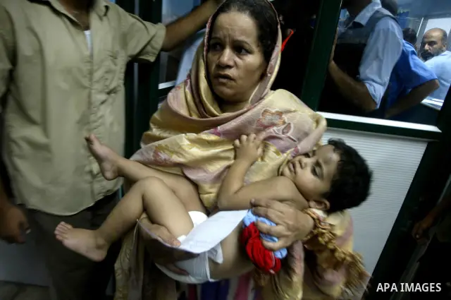 A wounded Palestinian child receives treatment at Al-Aqsa hospital in Deir el-Balah, central Gaza Strip, Monday, August 2, 2010. Early Monday, a huge blast leveled the house of a Hamas commander in the Deir el-Balah refu...