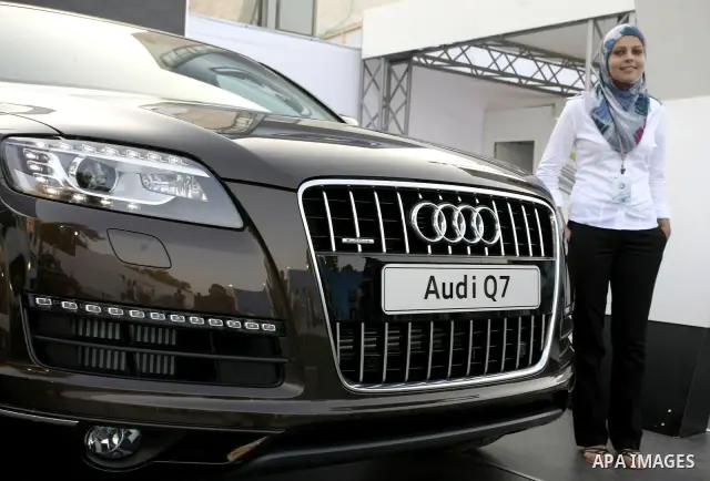Palestinians participate in the second car exhibition in the West Bank city of Ramallah on August 4,2010. Photo by Eyad Jadallah