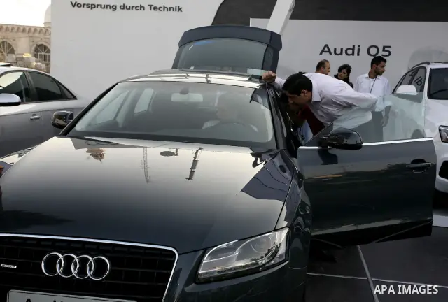 Palestinians participate in the second car exhibition in the West Bank city of Ramallah on August 4,2010. Photo by Eyad Jadallah