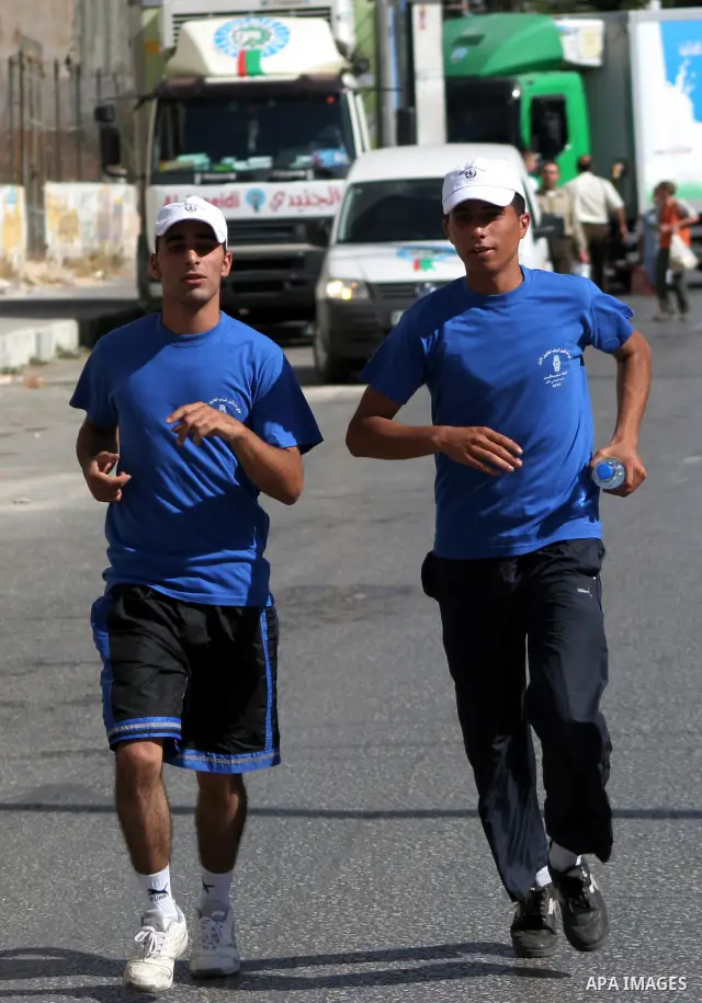 Palestinians run during the marathon in the West Bank city of Hebron on August 6,2010 . Photo by Mamoun Wazwaz