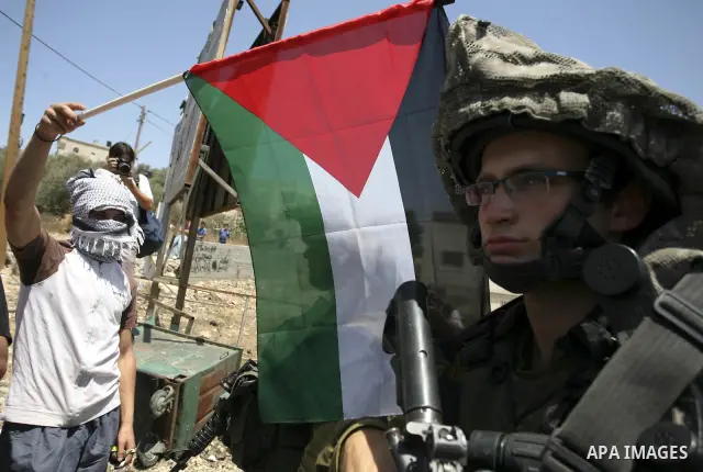 Demonstrators take part in a protest in the West Bank village of Nabi Saleh, on 06 August 2010. Residents of the village protest weekly against the neighbouring Jewish settlement of Halamish and the lack of water supply....