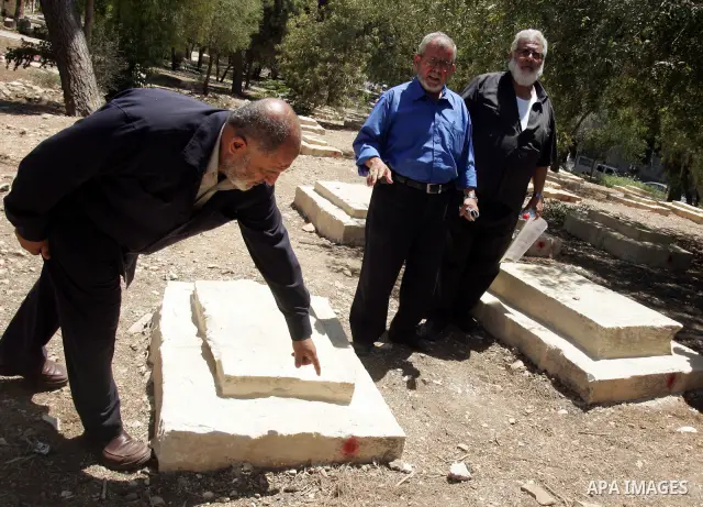 Palestinians show the destruction in the graves in the city of Jerusalem on August 6,2010. New plan for the Jerusalem municipality to remove the cemetery of Mamun Allah in West Jerusalem as the graves that marked in red,...