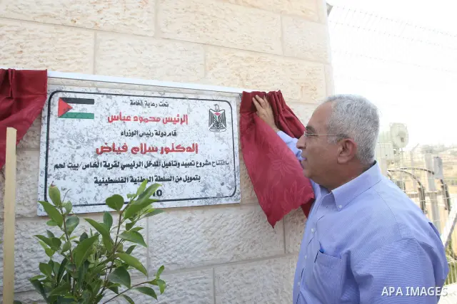 Palestinian Prime Minister Salam Fayyad opens the project of rehabilitation the main entrance to the village of Al-kass near the West Bank city of Bethlehem on August 7,2010. Photo by Mustafa Abu Dayeh / Pool