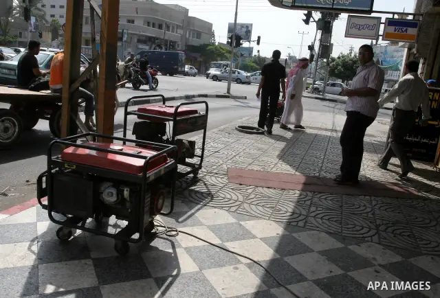 Palestinian man uses an electric generator as the lack of fuel to Gaza's power station, and the continued power outages in the city, on August 9, 2010 in Gaza City. Photo by Mohammed Asad