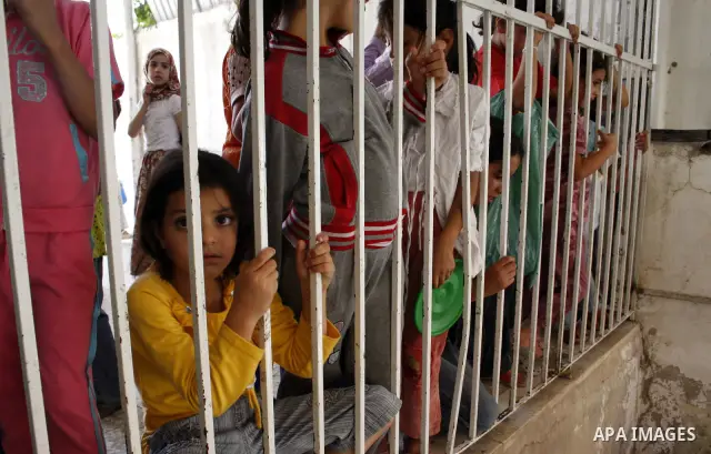 Palestinians receive donated food from an Islamic charity on the fourth day of the Muslim holy month of Ramadan, in the West Bank city of Hebron, Saturday, August 14, 2010. Devout Muslims refrain from eating, drinking an...